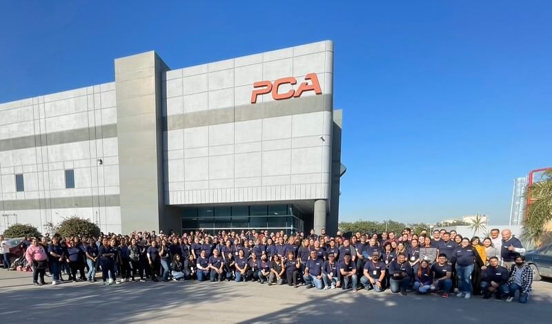 New Precision Cable Assembly facility in Monterrey Mexico with employees standing in front